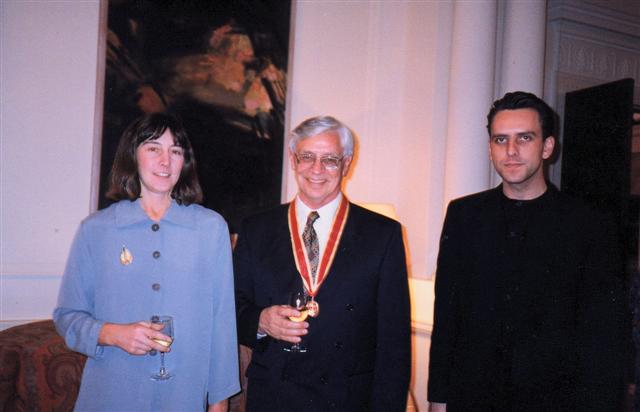 Mom takes a crooked snap of Linda, dad and me at dad's Knighthood ceremony.jpg 28.1K